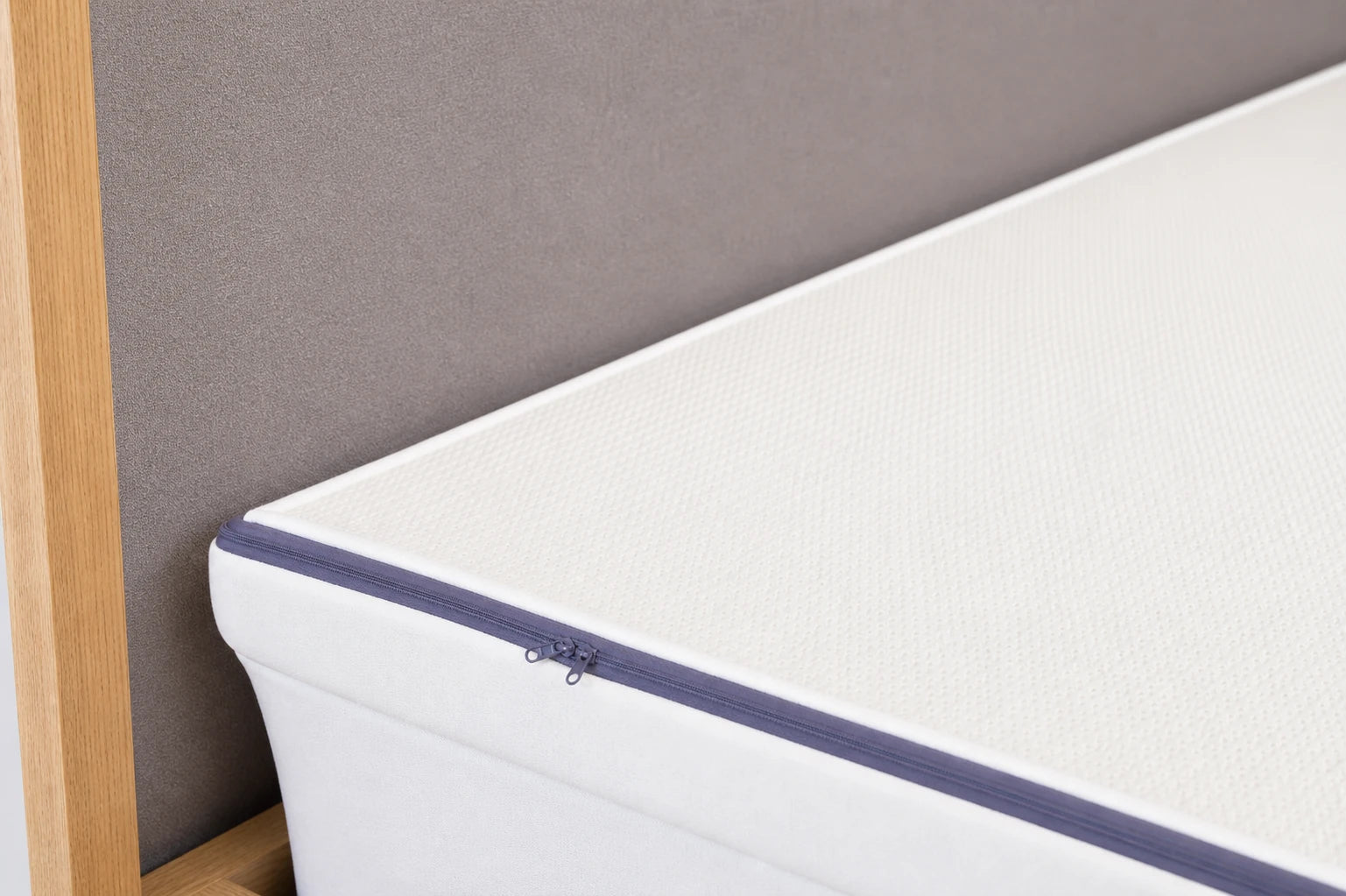 Close view of the topper cover over an existing mattress
